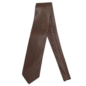 Cravatta di seta sartoriale di lusso, intricato motivo geometrico giallo su sfondo blu navy, fatta a mano in Italia

 